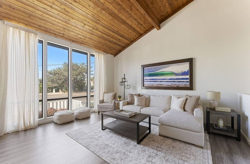 Upstairs living area with stunning ocean views and a 65-inch smart TV — perfect for binge-watching your favorite shows as the sun sets in the background!