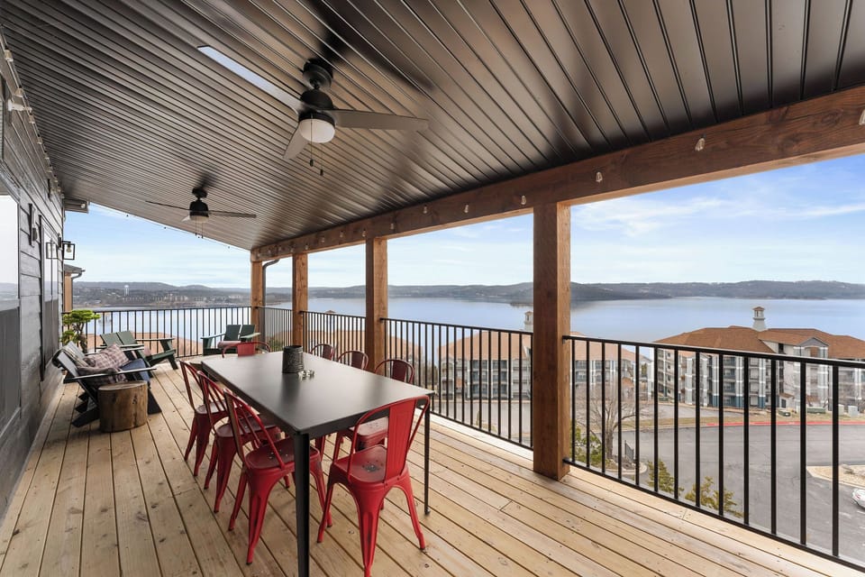 - Dine outdoors at a sleek table with seating for eight under a shaded, fan cooled space
- Enjoy panoramic lake views and breezy meals on this beautiful covered deck
- Ideal for group gatherings, sunset dinners, or relaxed morning coffee