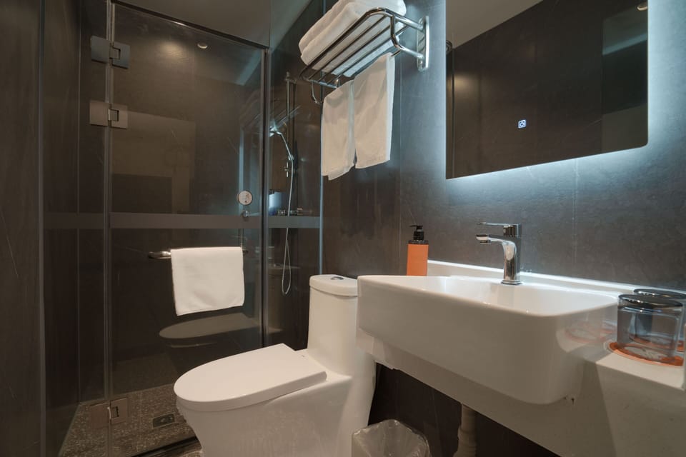 Basic Double Room, No Windows | Bathroom | Shower, hair dryer, slippers, towels