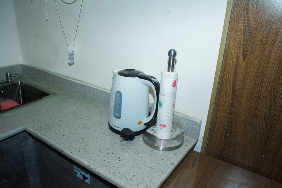 Apartment | Private kitchen | Mini-fridge, microwave, stovetop, cookware/dishes/utensils