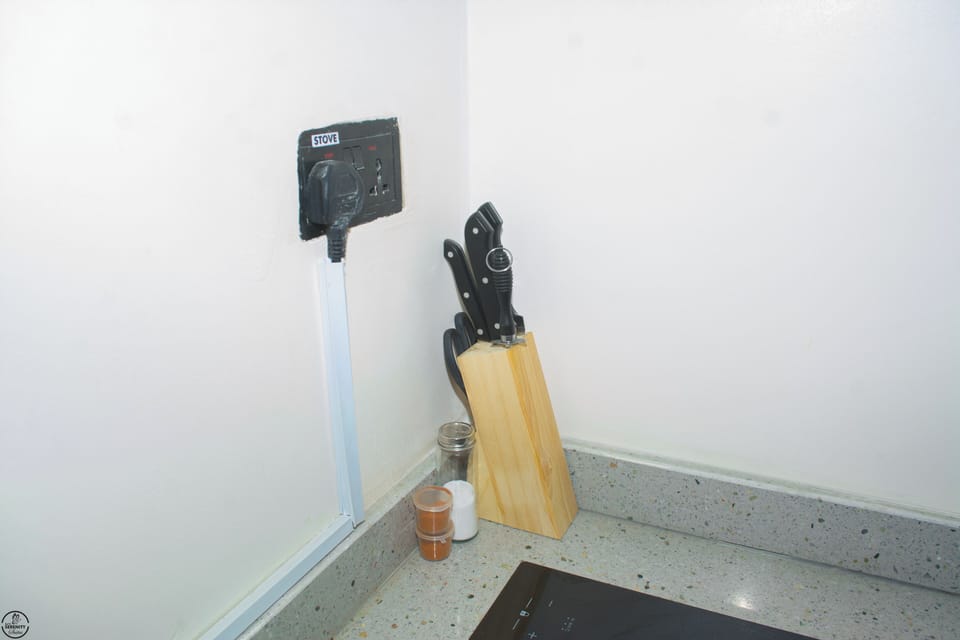 Apartment | Private kitchen | Mini-fridge, microwave, stovetop, cookware/dishes/utensils