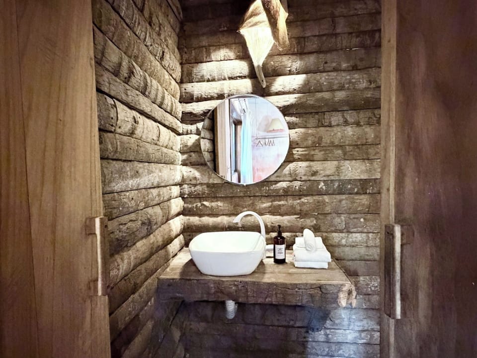 Separate tub and shower, towels, soap, shampoo