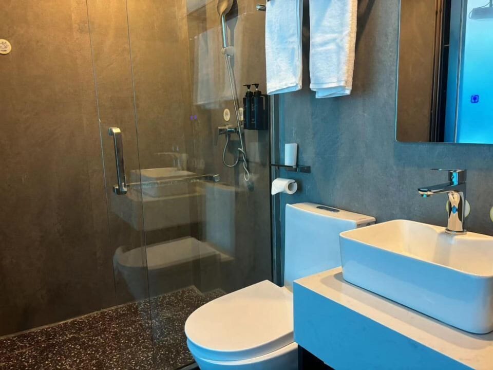 Shower, free toiletries, hair dryer, slippers