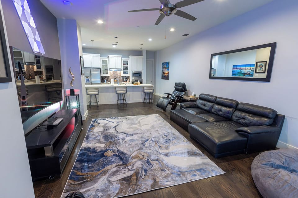 Living Room with 85" Samsung TV, Nanoleaf Lights, Perfect Chair Recliner