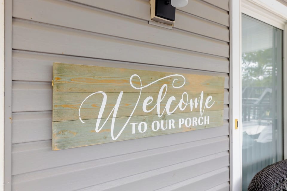 A warm greeting awaits on the inviting front porch.