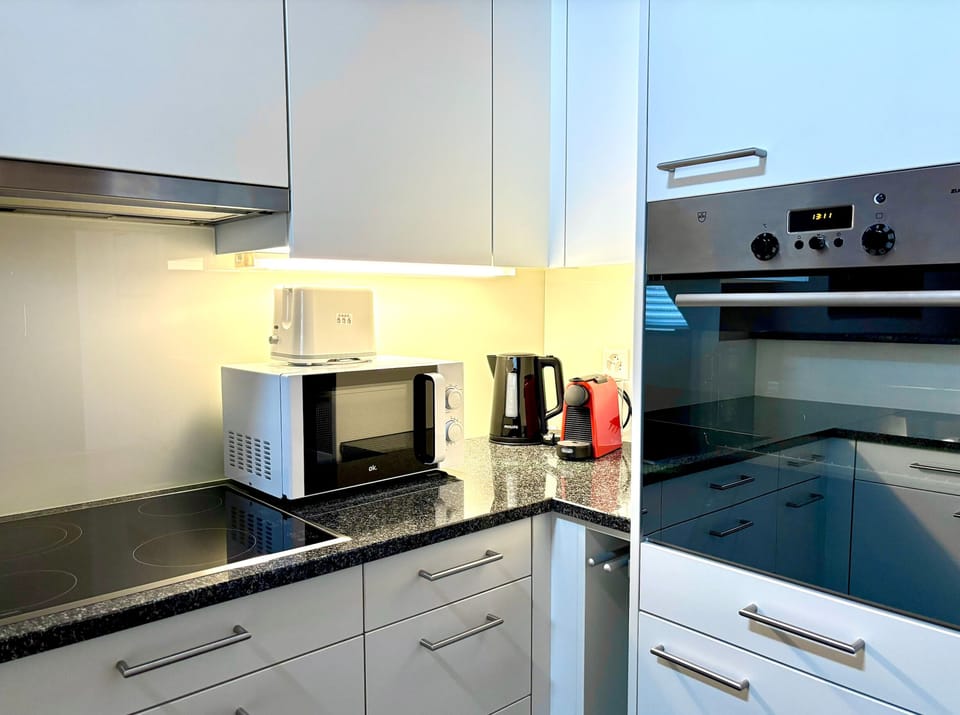 Comfort Apartment, Courtyard View | Private kitchen | Full-size fridge, microwave, oven, stovetop