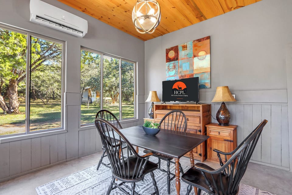 Flat screen TV in the dining, with viewing from the living room as well