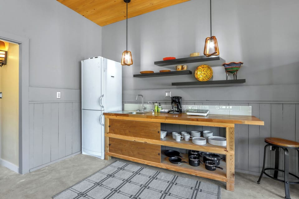 Kitchenette with a fridge and plenty of countertop space