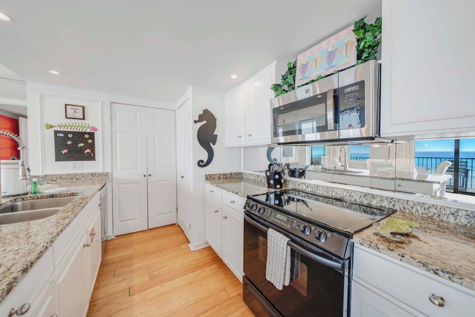 The fully equipped kitchen features granite countertops, mostly all stainless-steel appliances, and has everything you need to prepare meals for family & friends.