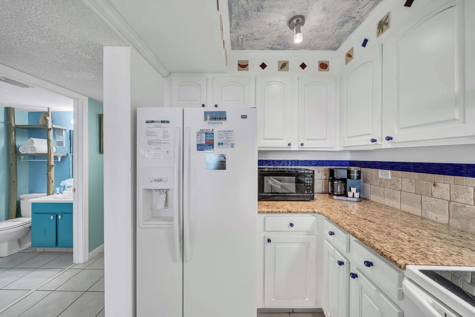 The fully equipped kitchen features granite countertops and has everything you need to prepare meals for family & friends.