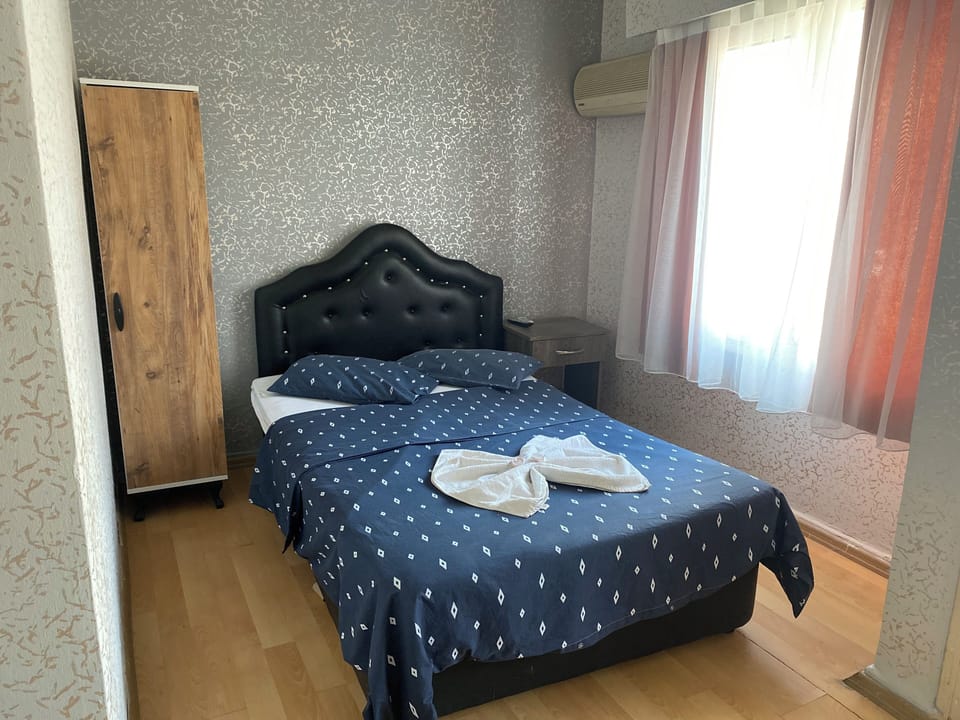 Economy Quadruple Room, City View | Desk, free WiFi
