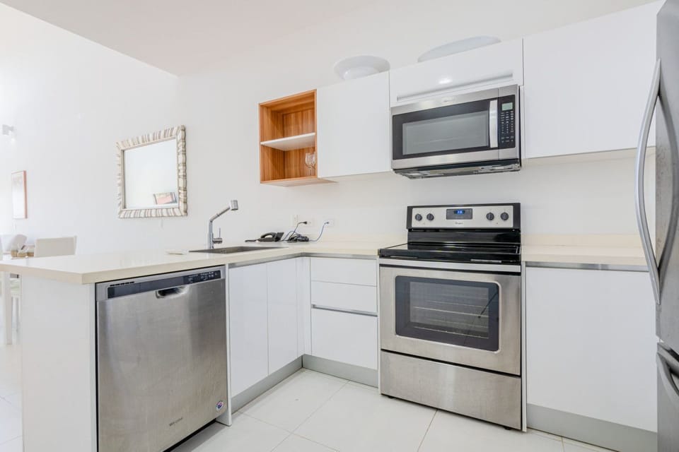 Cook like a pro in this fully equipped kitchen with sleek stainless steel appliances - Thoughtfully designed with plenty of counter space and all the tools you need - Perfect for preparing delicious meals or enjoying a morning coffee ritual