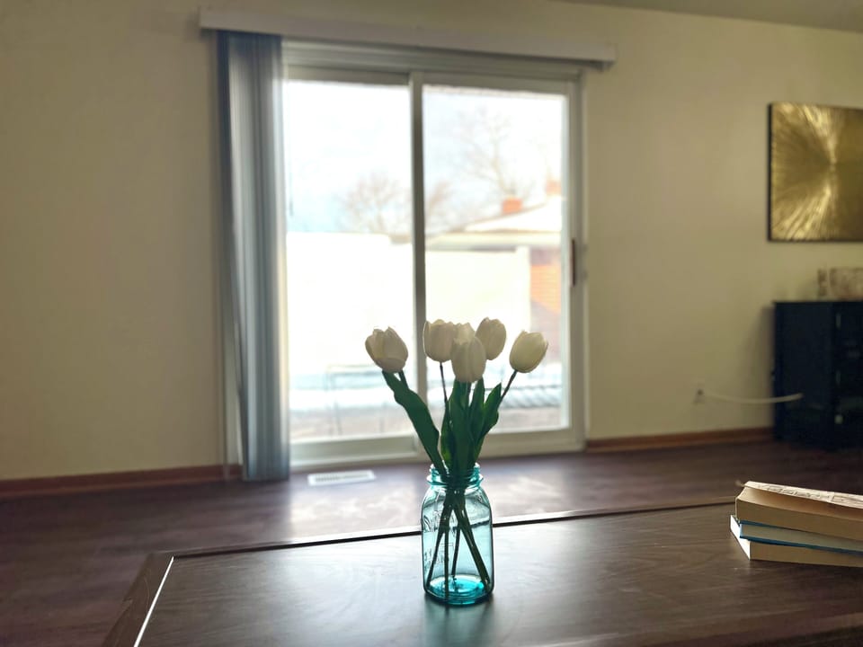 Reading nook facing out the back doors to the concrete patio outside.