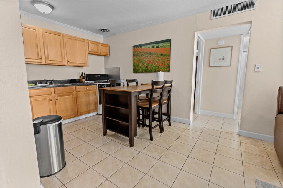 Kitchen and dining area in the open concept condo