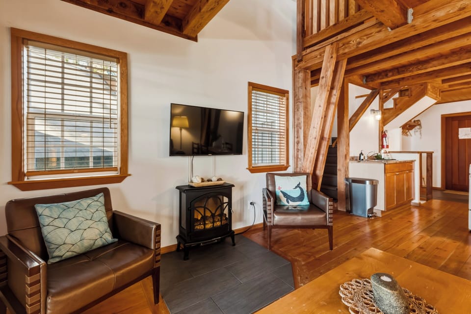 Rustic-style living area with a smart TV and cozy cabin charm. 