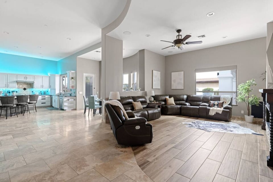 -Spacious open layout with kitchen and living area   - Leather sectional and bright natural light flow   - Perfect space for family gatherings and movie nights