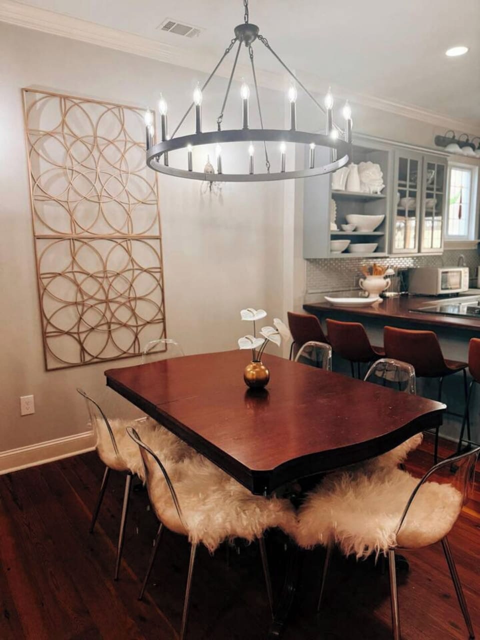 Gorgeous dining room featuring wagon wheel chandelier