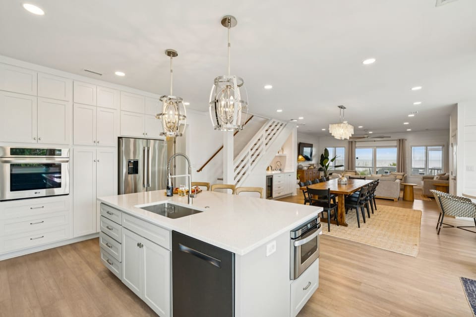 Enjoy the convenience of the kitchen overlooking the main dining area, perfect for family gatherings and easy serving.