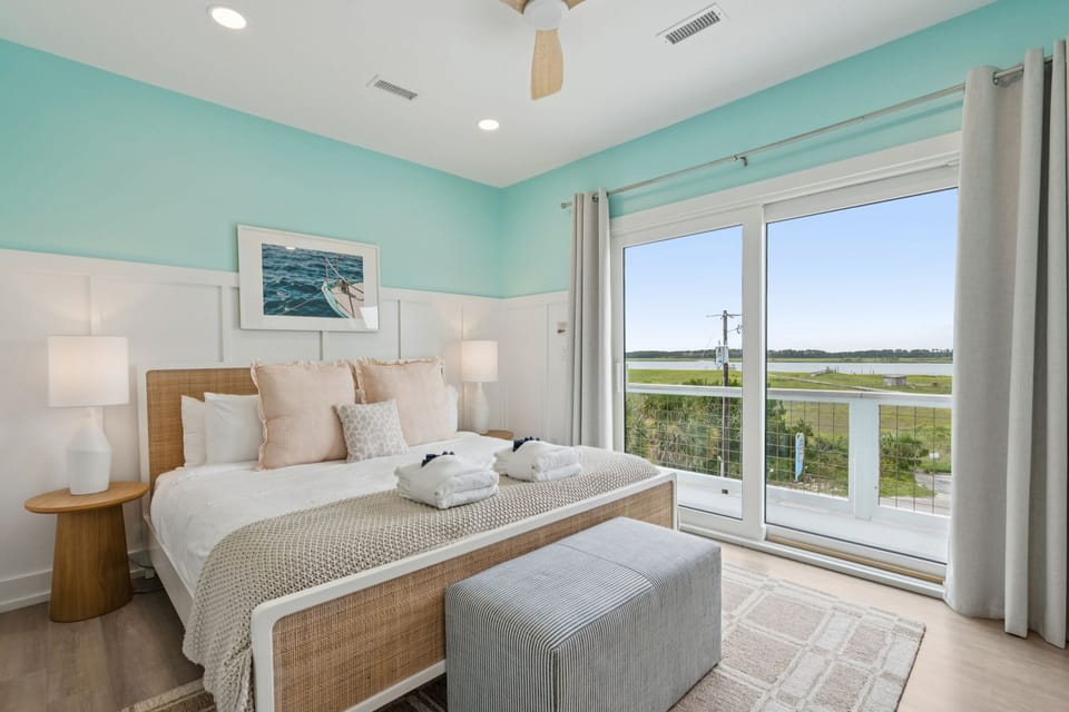 This comfy bedroom offers stunning, tranquil views right from your bed.