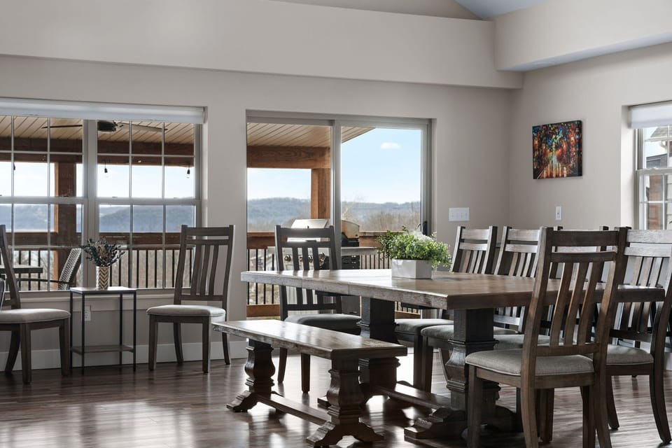 - Dine with a backdrop of rolling hills & lake views right outside your window
- Rustic wood table, bench seating, & natural light make every meal feel special
- Whether it's breakfast or a sunset dinner, this space invites you to slow down & savor