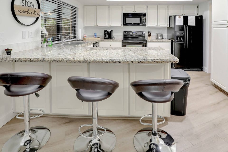 The kitchen offers ample storage and prep space.