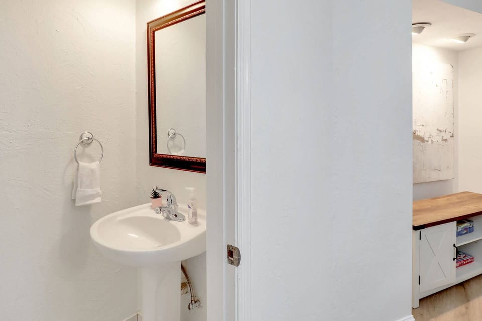 The powder half bath is located just off the dining area.