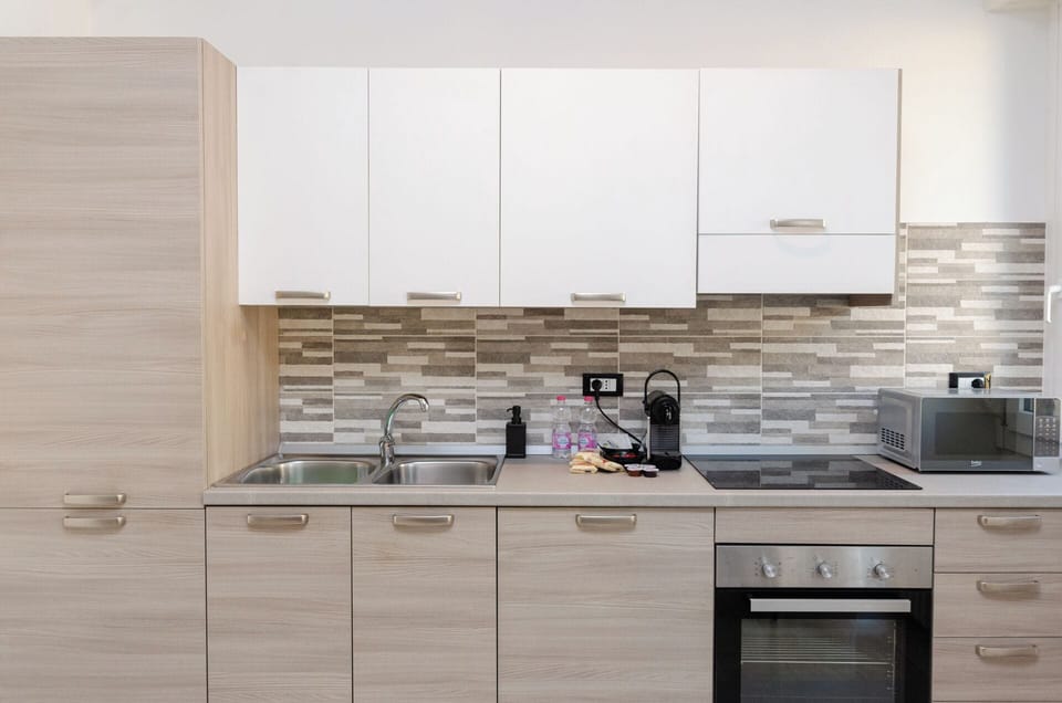 Apartment, Balcony, City View | Private kitchen | Full-size fridge, microwave, oven, stovetop