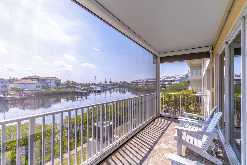 A screened in, canal view balcony with lounge seating, just off the living room. You can spend hours watching manatees here!