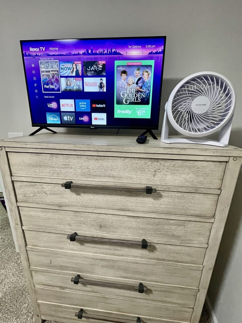 New 32 inch smart TV, located on stylish dresser in the guest bedroom.