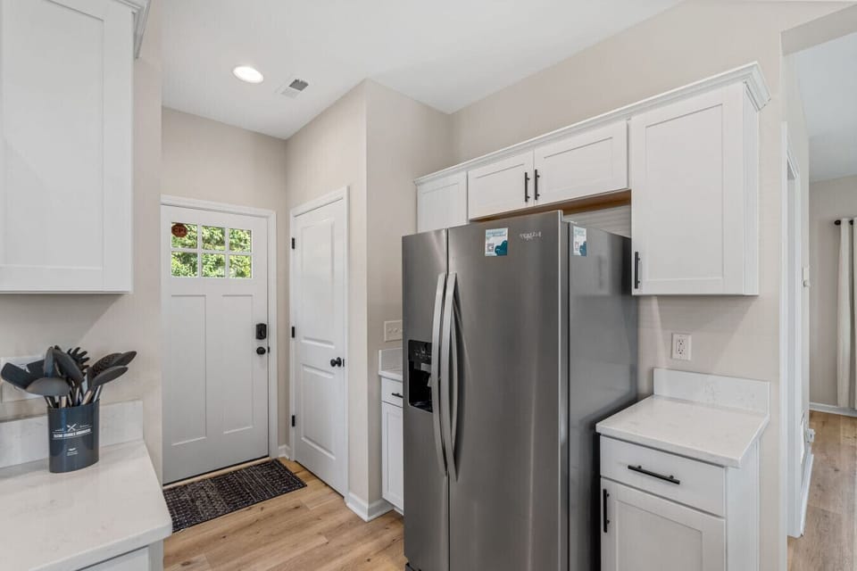 Our side door is next to our brand new fridge/freezer with ice maker and water dispenser.