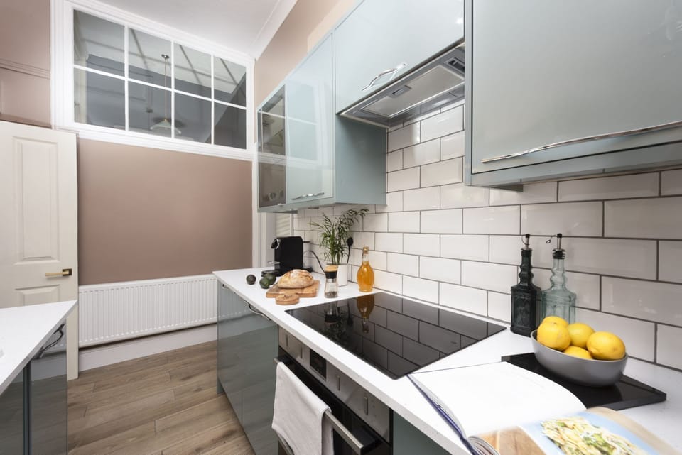 Kitchen space with a electric cooker - The Secret Seascape