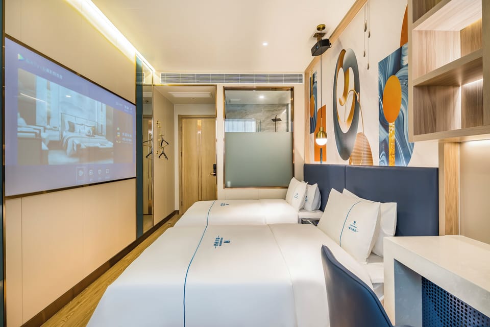 Premium bedding, down comforters, memory foam beds, minibar (free items)