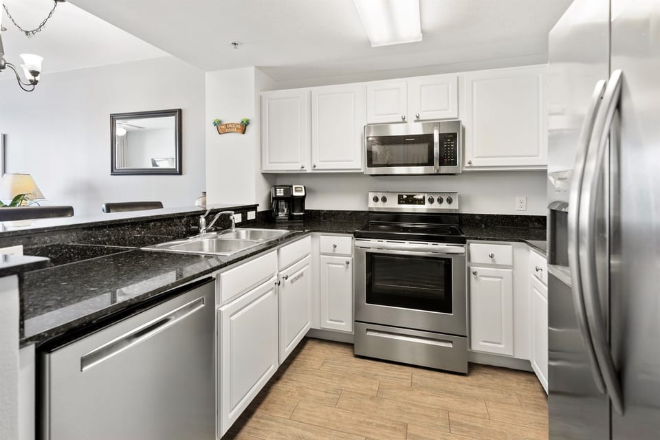 Your fully equipped kitchen features granite counters, stainless appliances, and everything needed to whip up delicious meals during your stay.
