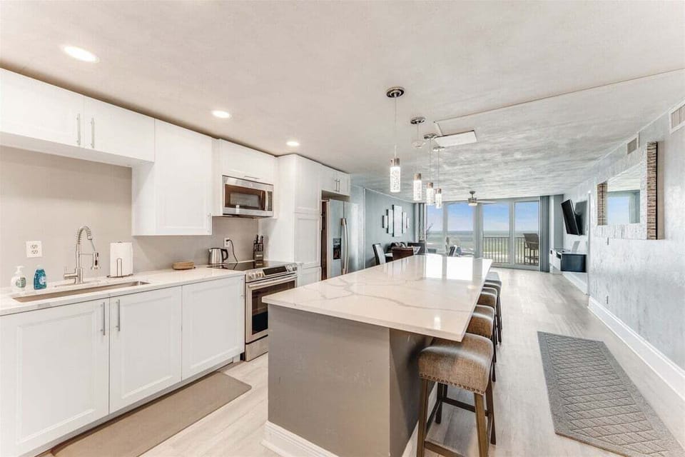 Bright full kitchen with island seating