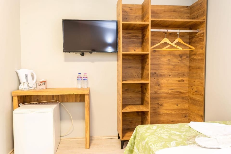 Desk, laptop workspace, free WiFi, bed sheets