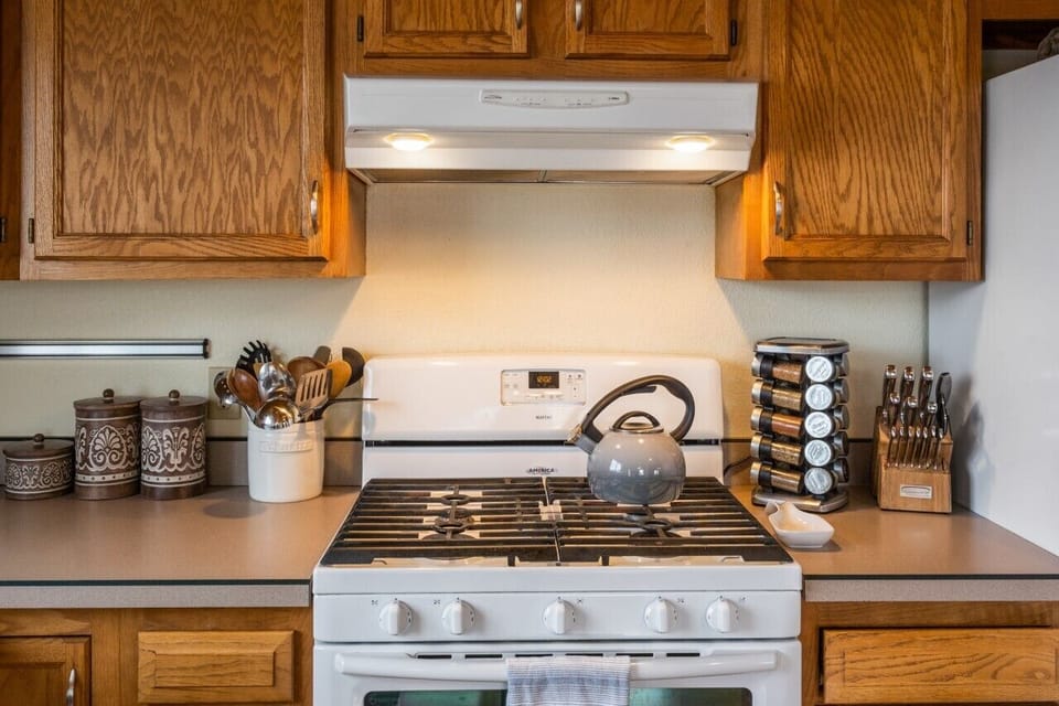 Kitchen has a drip coffee maker and a Keurig.
