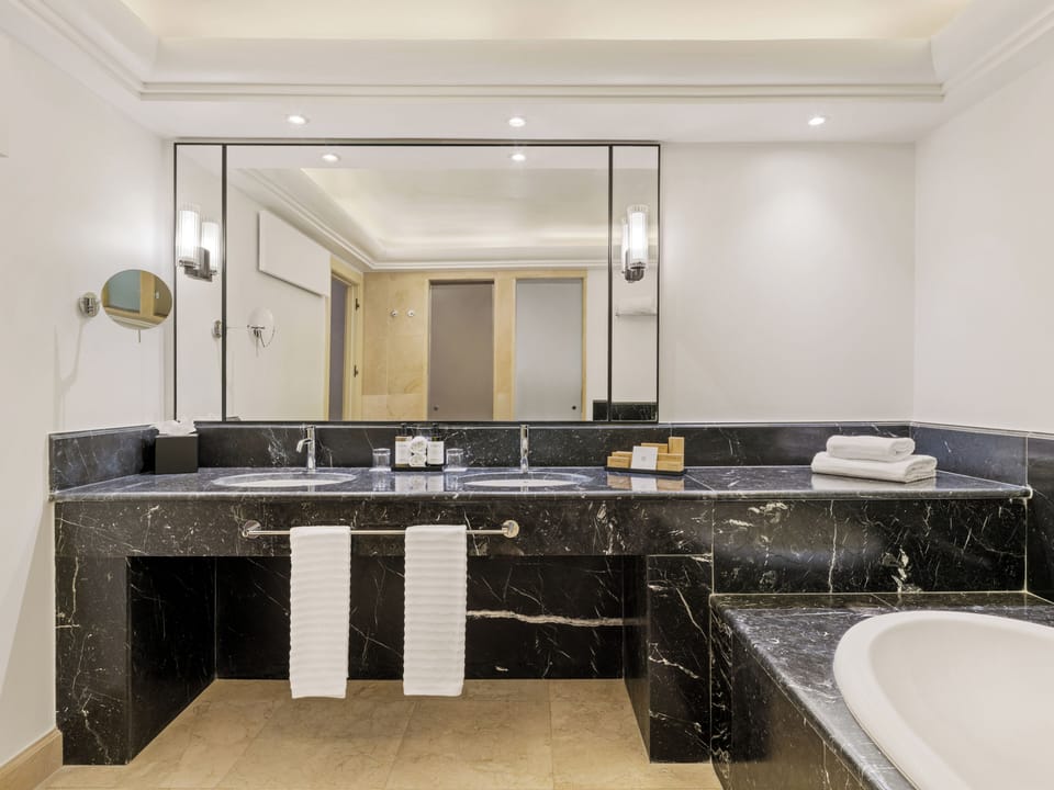 Combined shower/tub, hair dryer, slippers, towels