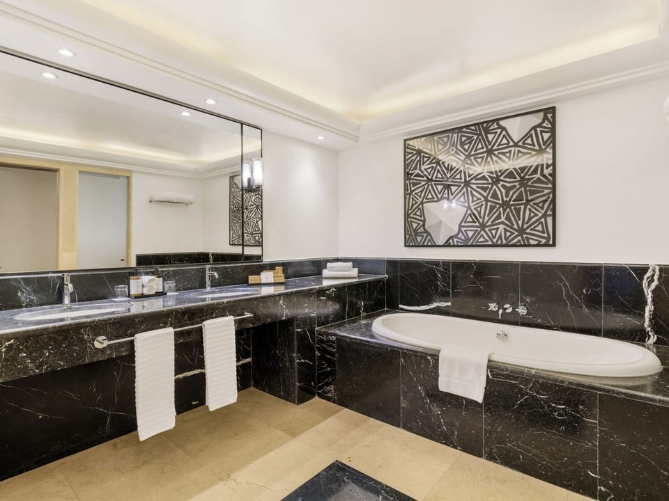 Junior Suite, Sea View | Bathroom | Combined shower/tub, hair dryer, slippers, towels