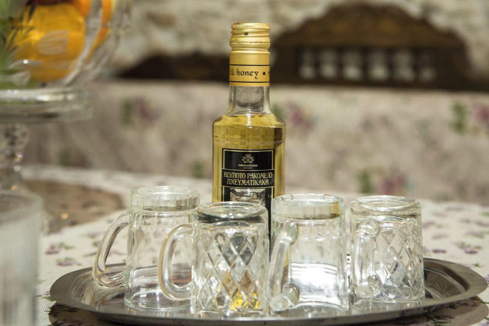 Traditional Cretan Welcome Drink – Enjoy local hospitality with raki and homemade treats.
