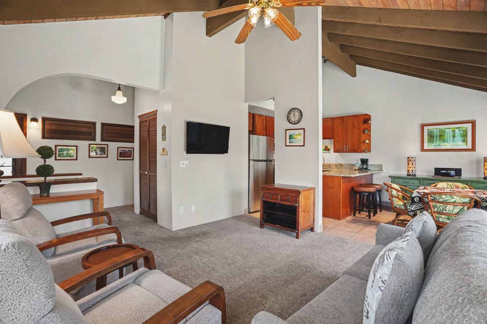 Step into your tropical retreat with soaring vaulted ceilings and an open-concept design that invites relaxation. Unwind on plush seating in the living area or whip up island-inspired meals in the full kitchen.