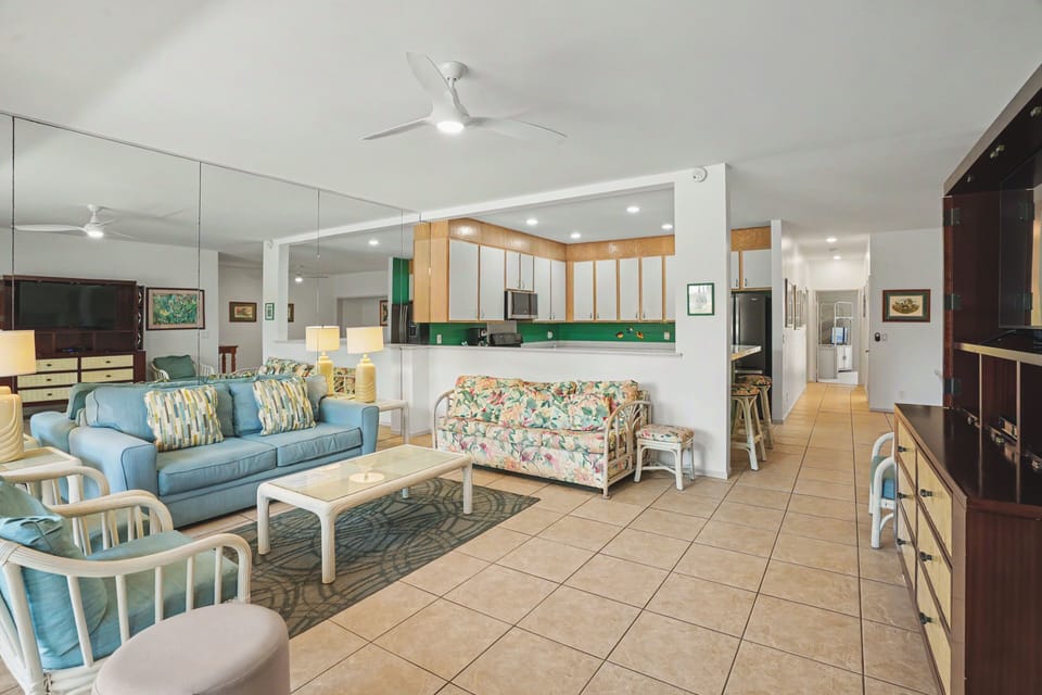 Step into your bright, open living space where island breezes flow through and coastal charm meets comfort—perfect for relaxing after a day of adventures.