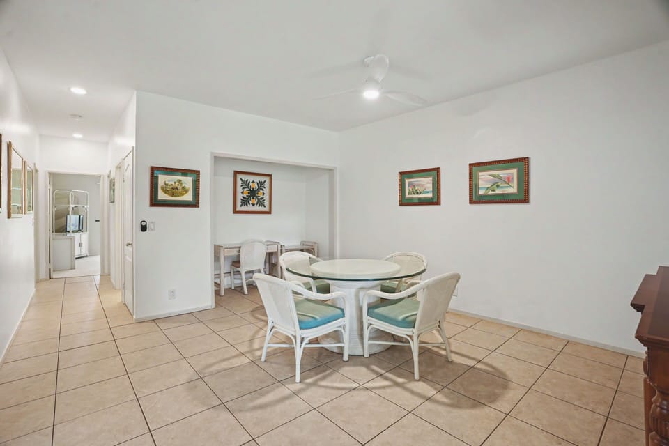 Gather around the bright dining area with comfortable seating for relaxed meals and lively conversation. Natural light fills the open space, creating a welcoming atmosphere for your stay.