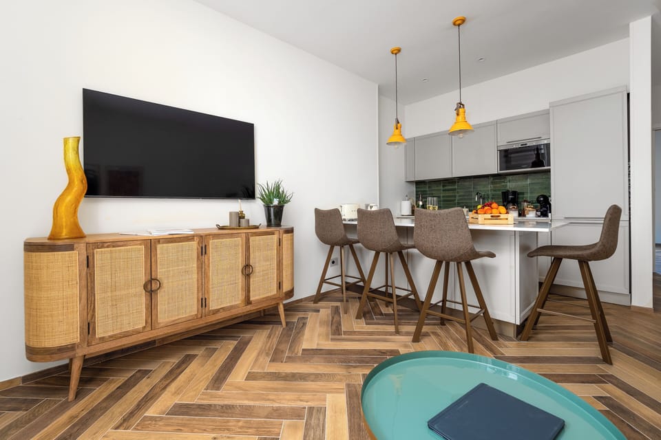 Luxury Apartment, Bay View | Living area | 50-inch flat-screen TV with satellite channels