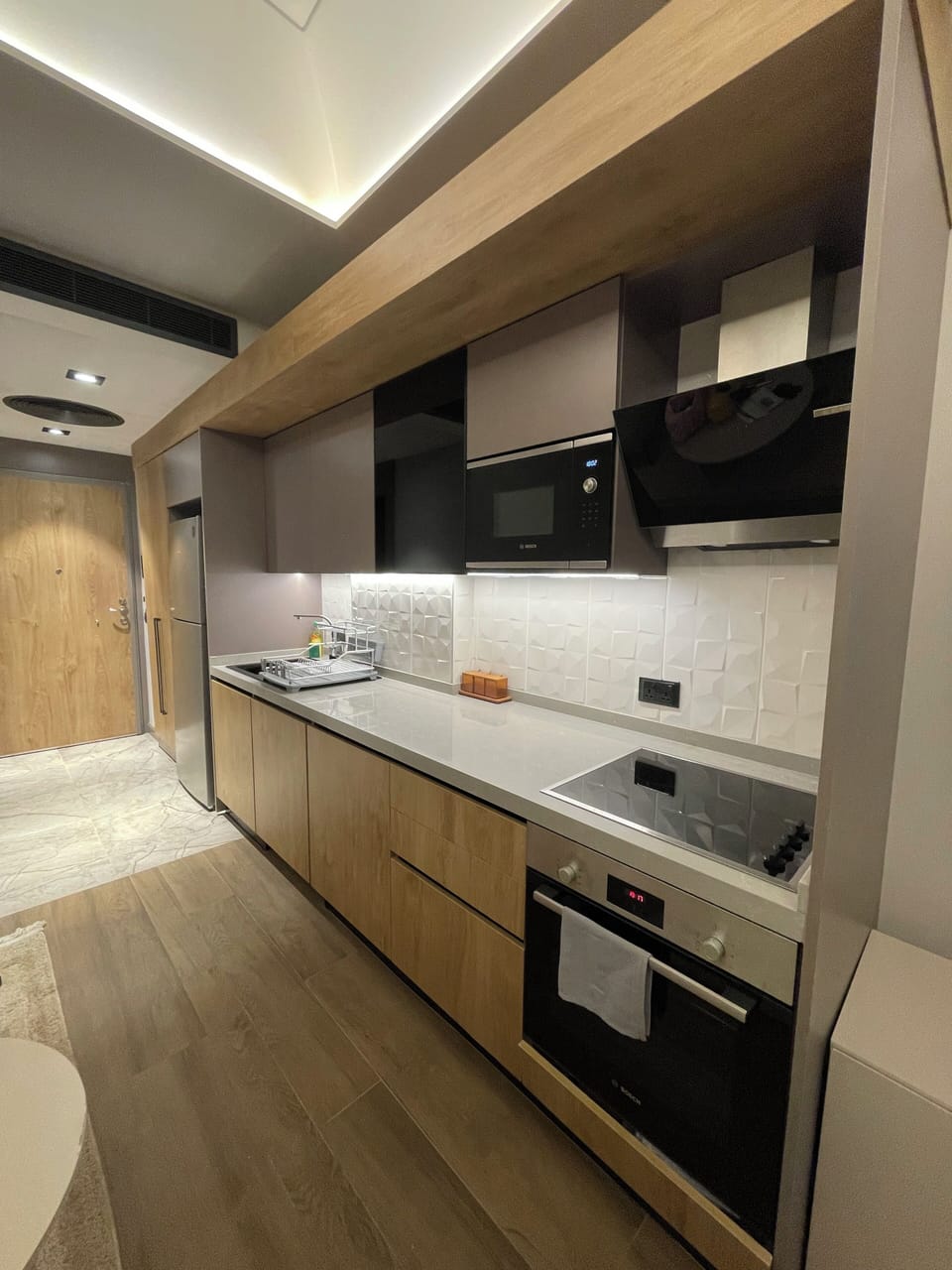Luxury Studio Suite, Courtyard View | Private kitchenette | Full-size fridge, microwave, oven, stovetop