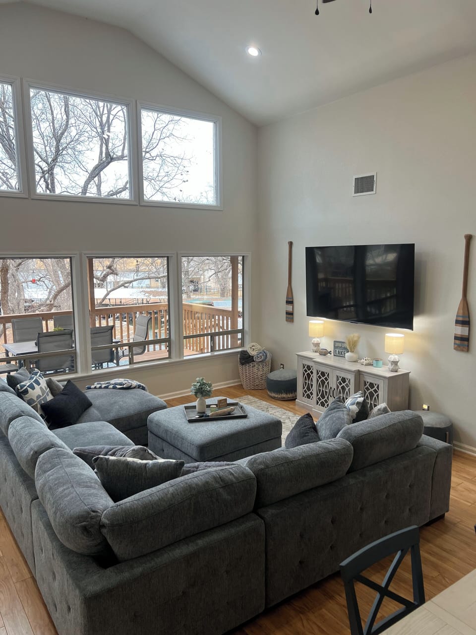 Comfortable living room sofa with sleeper and 75" TV with YouTube TV.