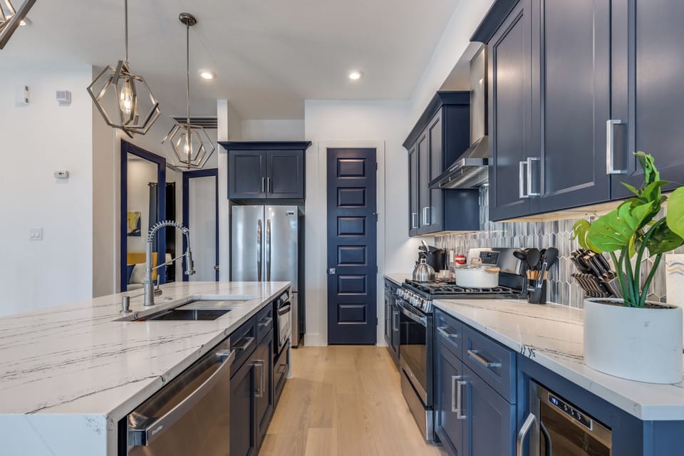 Full kitchen with dish washer, fridge/frezer, oven, stove, and microwave.