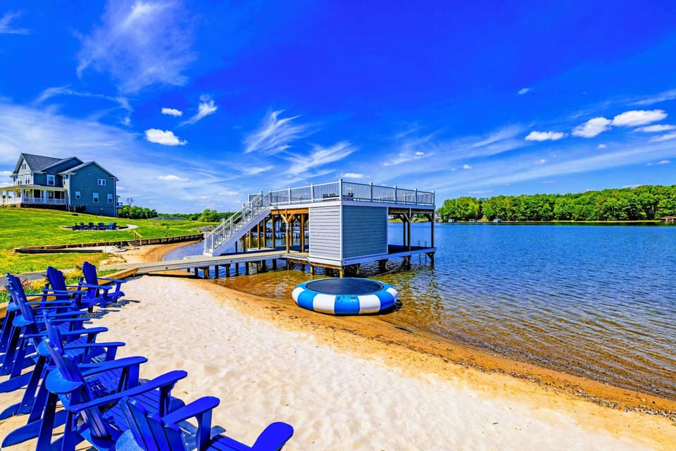 Backyard & Beach - Adirondack chairs in the sand, a floating water trampoline a few steps off shore, the dock right there.