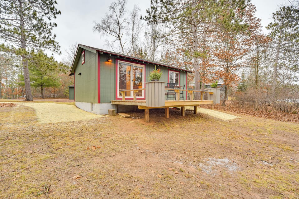Cabin Exterior | Spacious Yard | Furnished Deck
