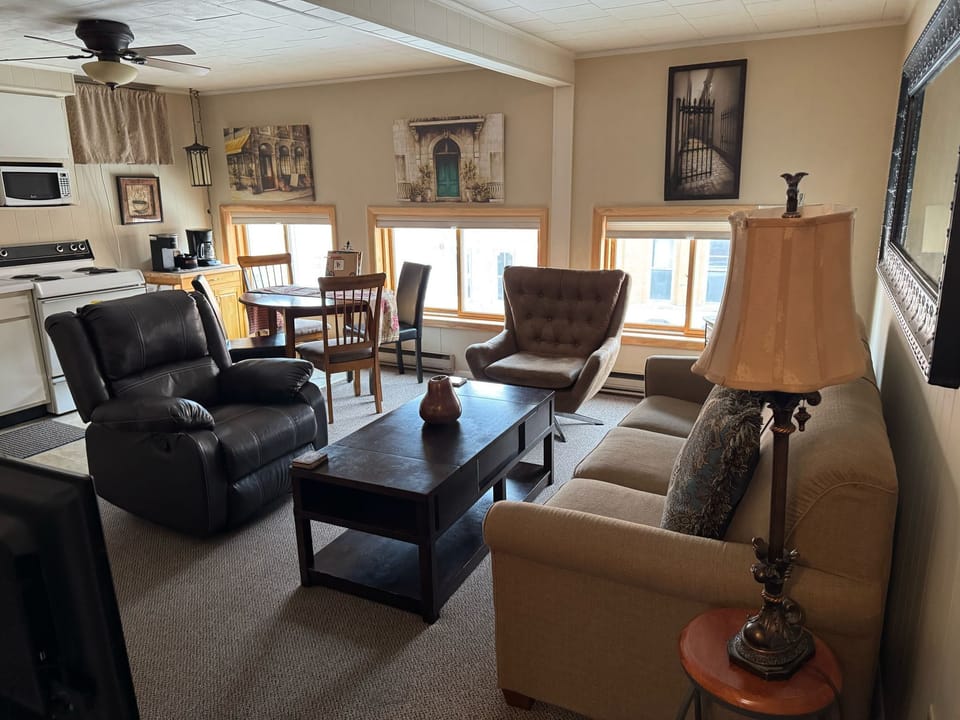 Swivel chair to enjoy views of Main Street along with a sofa sleeper