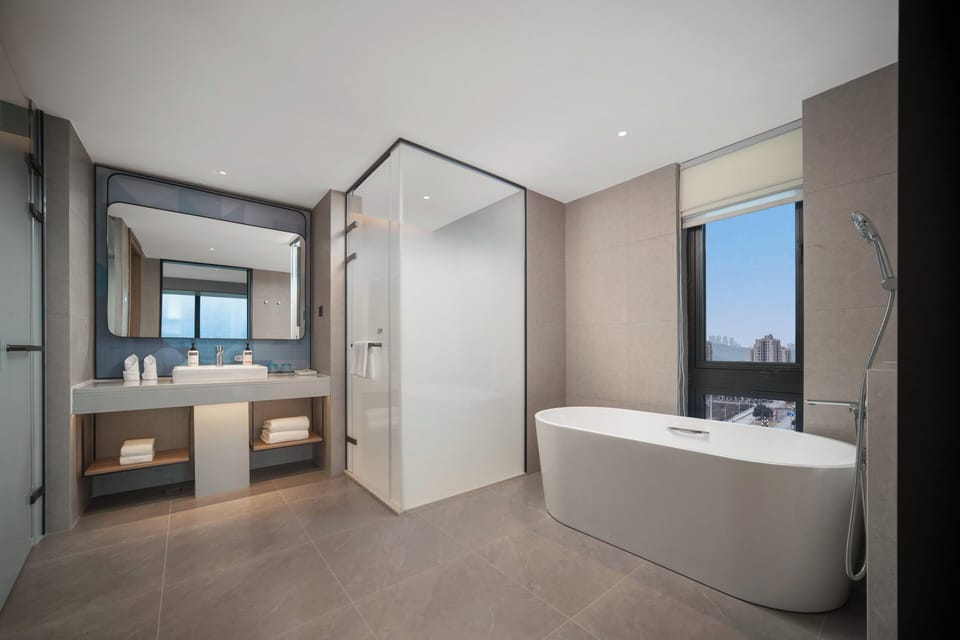 Suite, 1 Bedroom | Bathroom | Shower, free toiletries, hair dryer, slippers